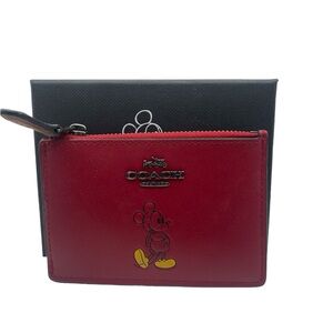 Coach Mickey Mouse ID holder, cc slots and zipper pocket. Used good condition.
